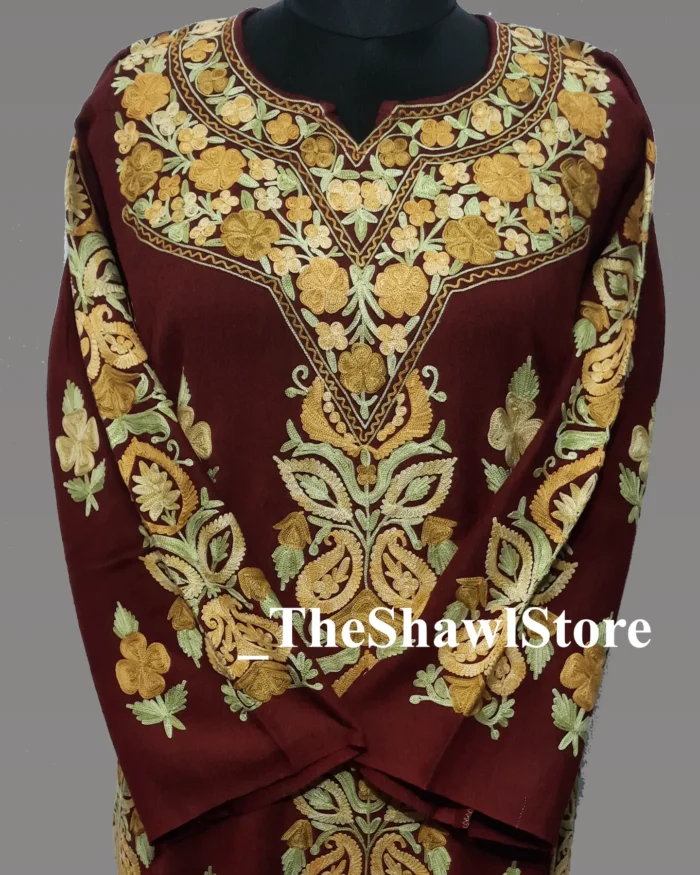 1000064383 4 <p>Luxuriate in the timeless elegance of The Shawl Store’s 56 Count Raffal Wool Ari Embroidery Kashmiri Pheran. Merging the allure of Kashmiri craftsmanship with the finest materials, this exceptional pheran exemplifies understated opulence.</p>
<p>Delight in the ethereal feel of 56 count Raffal wool against your skin. Each thread is delicately spun to create a lightweight fabric that drapes effortlessly, granting you unrestricted movement and comfort. Experience the delicate embrace of pure luxury.</p>
<p>Prepare to be mesmerized by the extraordinary artistry showcased in the meticulous Ari embroidery adorning this pheran. Skilled artisans have poured their hearts and talents into creating exquisite patterns that intertwine tradition and sophistication. Every stitch and motif offers a nod to timeless beauty, truly making this garment a sight to behold.</p>
<p>Radiate elegance wherever you go as you envelop yourself in the 56 Count Raffal Wool Ari Embroidery Kashmiri Pheran. Be it at a wedding or a soirée, this extraordinary piece will captivate all those who lay eyes on you, instantly recognizing your refined taste and appreciation for true craftsmanship.</p>
<p>Experience the ultimate luxury with The Shawl Store. Shop our collection now and seize the opportunity to own a piece of Kashmiri heritage reimagined for the modern connoisseur.</p>