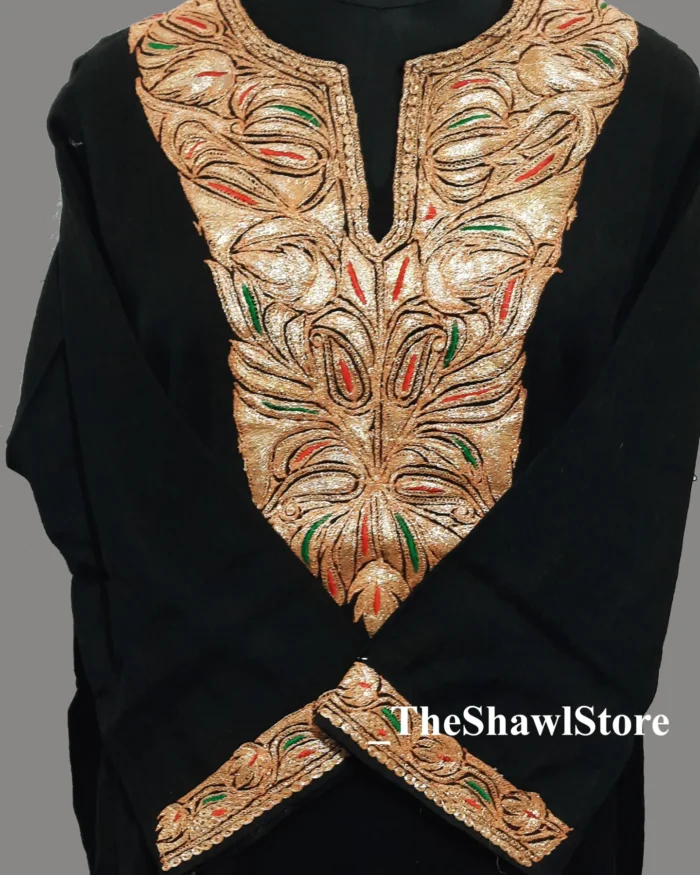 1000071386 <strong>Indulge in Elegance with The Shawl Store’s 42 Count Tilla Embroidery Pheran</strong> Immerse yourself in the opulence of our 42 Count Tilla Embroidery Kashmiri Pheran from The Shawl Store. This exquisite piece of craftsmanship showcases the intricate beauty of traditional Kashmiri embroidery, harmoniously blending tradition and luxury. Meticulously handwoven using the finest quality fabrics, this pheran effortlessly drapes over your shoulders, enveloping you in sheer elegance. Elevate any ensemble with the soft, supple touch of this luxurious shawl, a testament to timeless style and refined taste.