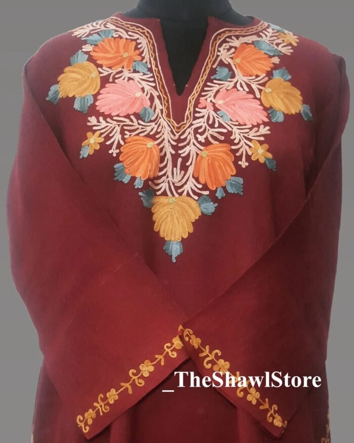 1000073901 Experience the allure of Kashmir’s rich heritage with our breathtaking range of Ari Embroidery Shawls, exclusively curated by The Shawl Store. Immerse yourself in the regal charm of the Kashmiri Pheran, as these impeccably crafted shawls embrace you with their luxurious warmth. Adorned with elaborate embroidery patterns and handcrafted motifs, our shawls boast an unrivaled level of artistry and attention to detail. Made with the finest Cashmilon material, they provide a sumptuous drape while enveloping you in sheer indulgence. Unleash your inner elegance and step into a world of lavish glamour with our Ari Embroidery Shawls.