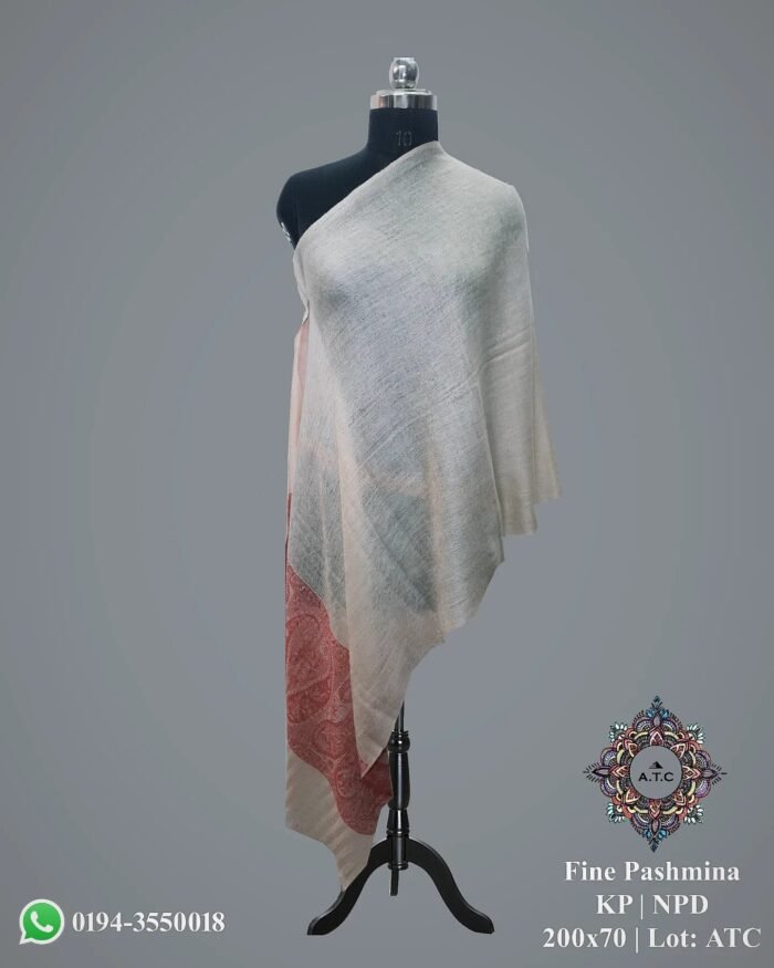 1000075317 Elevate your ensemble to new heights of elegance and allure with the Kani Pala Pashmina Shawl, curated exclusively by The Shawl Store. Immerse yourself in a realm of heritage and luxury as you adorn this timeless masterpiece, crafted with utmost precision and finesse. The intricate design, meticulously woven by skilled artisans, adorns the plush Pashmina wool with a tapestry of opulence. This lightweight shawl, delicately draped across your shoulders, showcases the harmonious blend of tradition and contemporary allure. Experience the sheer pleasure of enveloping yourself in this symbol of artisan mastery, and let the world marvel at your impeccable taste in luxury fashion.