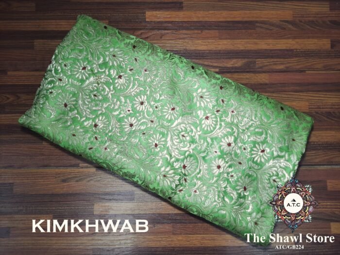 1000080574 Indulge in the timeless beauty of Pure Silk Kimkhab Fabric, exclusively available at The Shawl Store. Crafted from the finest silk, this Brocade Banarasi fabric boasts a rich texture and intricate brocade work that is sure to make a statement. Whether for a special occasion or everyday wear, this luxurious fabric is a must-have for any fashion enthusiast. <strong><em>Quantity: </em></strong><em>1 Piece/Unit = 1 Metre</em>