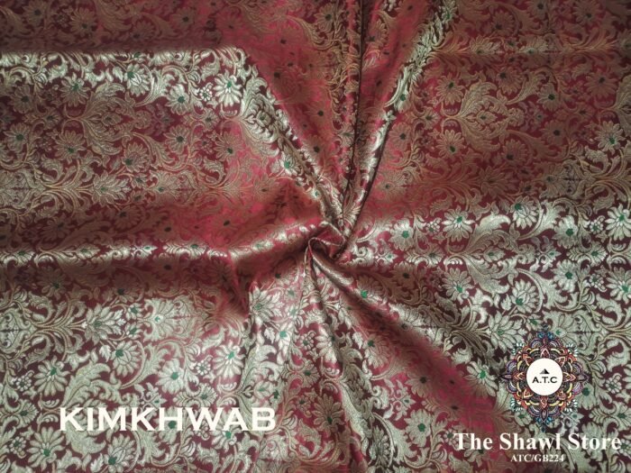 1000086030 Indulge in the timeless beauty of Pure Silk Kimkhab Fabric, exclusively available at The Shawl Store. Crafted from the finest silk, this Brocade Banarasi fabric boasts a rich texture and intricate brocade work that is sure to make a statement. Whether for a special occasion or everyday wear, this luxurious fabric is a must-have for any fashion enthusiast. <strong><em>Quantity: </em></strong><em>1 Piece/Unit = 1 Metre</em>