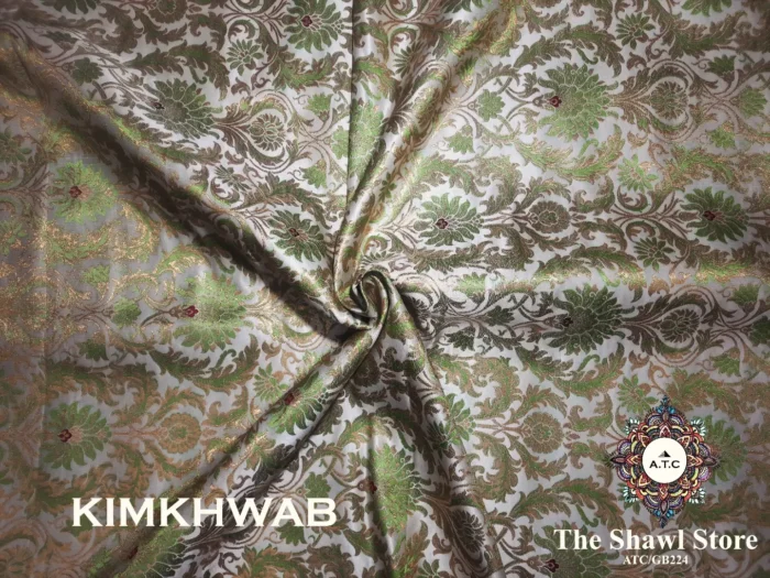 IMG 20240415 084954 597 Indulge in the timeless beauty of Pure Silk Kimkhab Fabric, exclusively available at The Shawl Store. Crafted from the finest silk, this Brocade Banarasi fabric boasts a rich texture and intricate brocade work that is sure to make a statement. Whether for a special occasion or everyday wear, this luxurious fabric is a must-have for any fashion enthusiast. <strong><em>Quantity: </em></strong><em>1 Piece/Unit = 1 Metre</em>