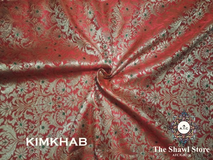 IMG 20240509 205450 250 Indulge in the timeless beauty of Pure Silk Kimkhab Fabric, exclusively available at The Shawl Store. Crafted from the finest silk, this Brocade Banarasi fabric boasts a rich texture and intricate brocade work that is sure to make a statement. Whether for a special occasion or everyday wear, this luxurious fabric is a must-have for any fashion enthusiast. <strong><em>Quantity: </em></strong><em>1 Piece/Unit = 1 Metre</em>