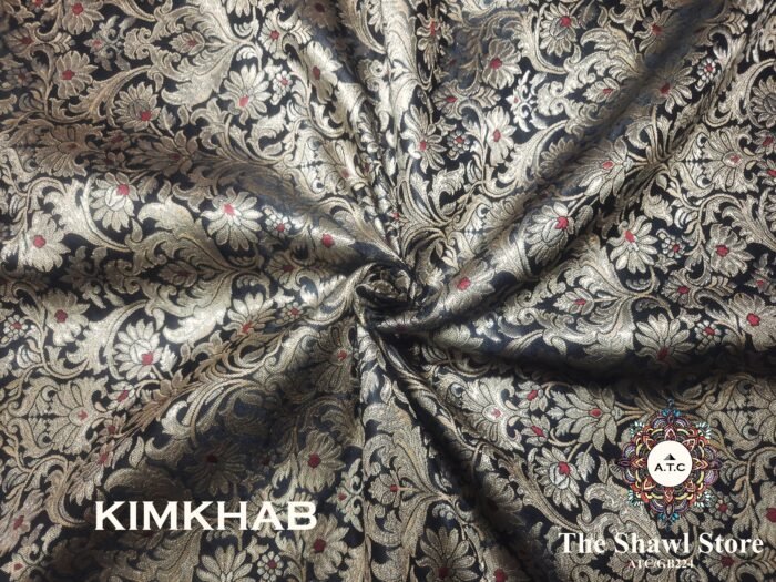 IMG 20240511 142013 507 Indulge in the timeless beauty of Pure Silk Kimkhab Fabric, exclusively available at The Shawl Store. Crafted from the finest silk, this Brocade Banarasi fabric boasts a rich texture and intricate brocade work that is sure to make a statement. Whether for a special occasion or everyday wear, this luxurious fabric is a must-have for any fashion enthusiast. <strong><em>Quantity: </em></strong><em>1 Piece/Unit = 1 Metre</em>