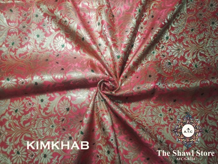 IMG 20240515 082944 871 Indulge in the timeless beauty of Pure Silk Kimkhab Fabric, exclusively available at The Shawl Store. Crafted from the finest silk, this Brocade Banarasi fabric boasts a rich texture and intricate brocade work that is sure to make a statement. Whether for a special occasion or everyday wear, this luxurious fabric is a must-have for any fashion enthusiast. <strong><em>Quantity: </em></strong><em>1 Piece/Unit = 1 Metre</em>