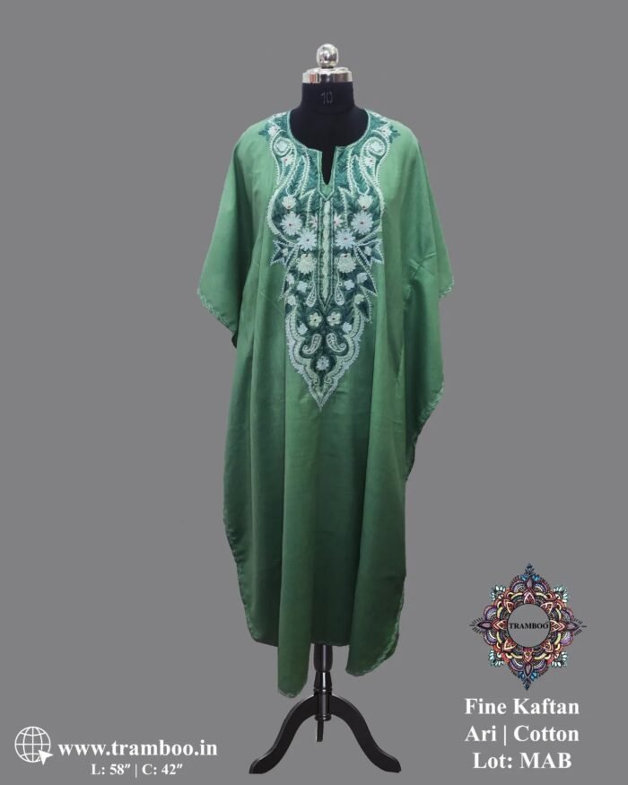 1000097895 Embrace comfort and style with this beautiful Kaftan Dress by The Shawl Store. Made from lightweight fine cotton, this dress is ideal for hot summer days when you want to look and feel cool. The flowy silhouette and intricate prints make it a versatile piece for any occasion.