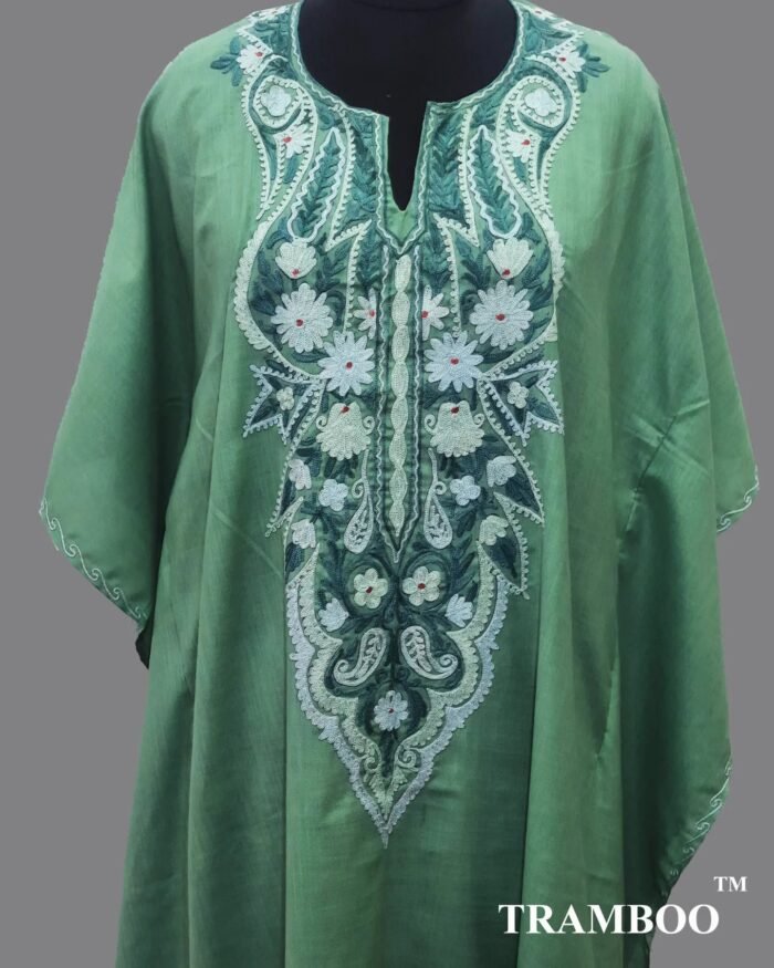 1000097897 Embrace comfort and style with this beautiful Kaftan Dress by The Shawl Store. Made from lightweight fine cotton, this dress is ideal for hot summer days when you want to look and feel cool. The flowy silhouette and intricate prints make it a versatile piece for any occasion.