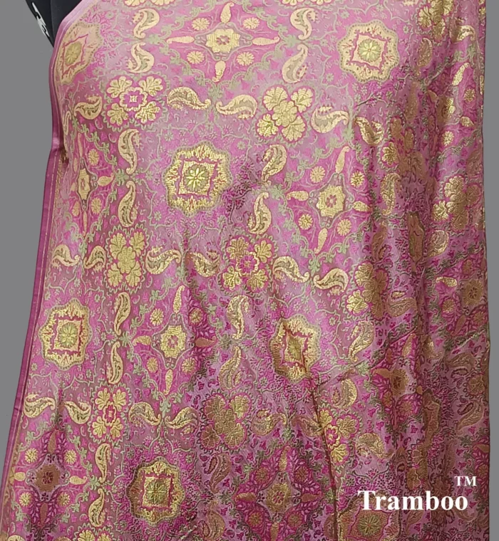 1725025257280 Experience the epitome of luxury with Tanchoi Brocade, available exclusively at The Shawl Store. Impeccably woven with a blend of silk and metallic threads, this stunning shawl features a delicate pattern that adds a touch of grandeur to any outfit. Treat yourself to the lavish beauty of Tanchoi Brocade from The Shawl Store. <strong><em>Quantity: </em></strong><em>1 Piece/Unit = 1 Metre</em>